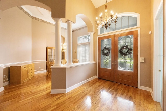 12002 Hope Ln, Tampa, FL 33618 - foyer with high vaulted ceiling, light wood-style flooring, french doors, and baseboards