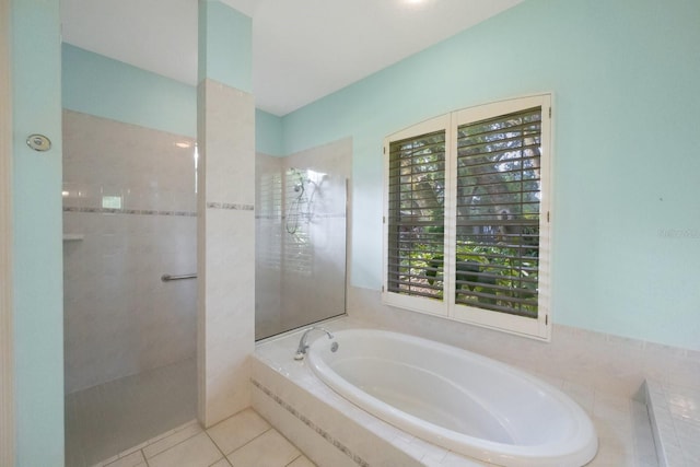 12002 Hope Ln, Tampa, FL 33618 - full bath featuring a walk in shower, a garden tub, and tile patterned flooring
