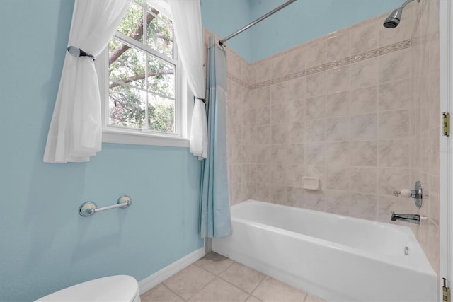 12002 Hope Ln, Tampa, FL 33618 - full bathroom featuring tile patterned flooring, baseboards, healthy amount of natural light, and shower / tub combo