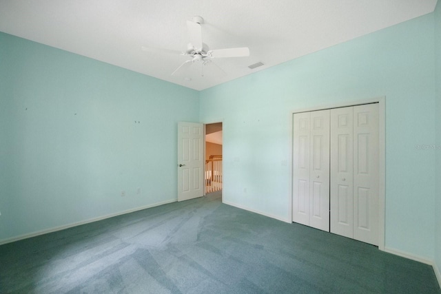 12002 Hope Ln, Tampa, FL 33618 - unfurnished bedroom featuring carpet, baseboards, a ceiling fan, and a closet