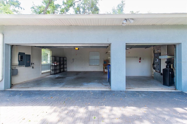 12002 Hope Ln, Tampa, FL 33618 - garage featuring driveway and electric panel