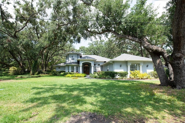 12002 Hope Ln, Tampa, FL 33618 - view of front of property featuring a front yard and stucco siding