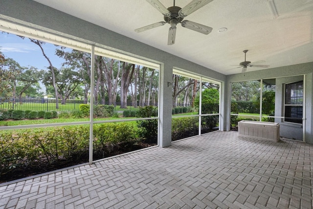 12002 Hope Ln, Tampa, FL 33618 - unfurnished sunroom featuring a ceiling fan