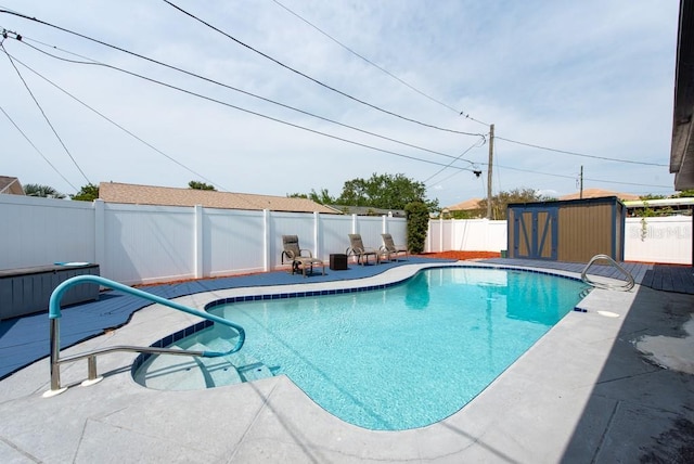 8305 75th Pl, Seminole, FL 33777 - view of swimming pool with a fenced backyard, a shed, an outdoor structure, and a patio area