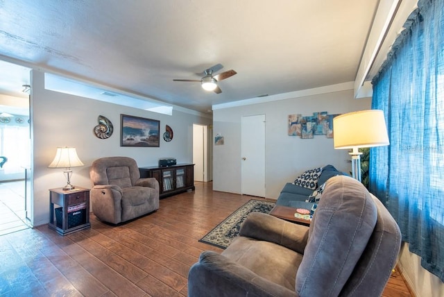 8305 75th Pl, Seminole, FL 33777 - living area with a ceiling fan, wood finished floors, and crown molding