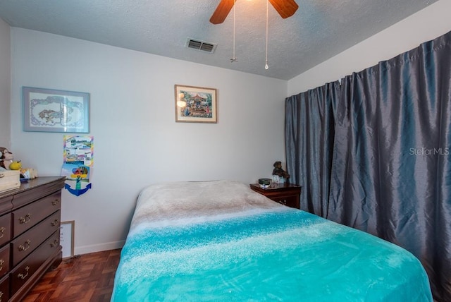 8305 75th Pl, Seminole, FL 33777 - bedroom with a textured ceiling, a ceiling fan, and baseboards