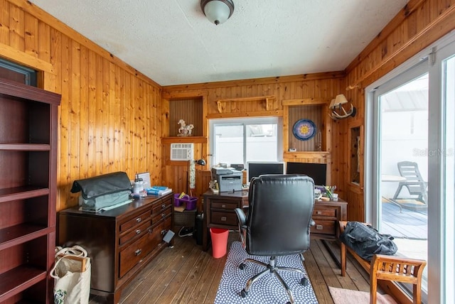 8305 75th Pl, Seminole, FL 33777 - home office with wooden walls, dark wood finished floors, and a textured ceiling