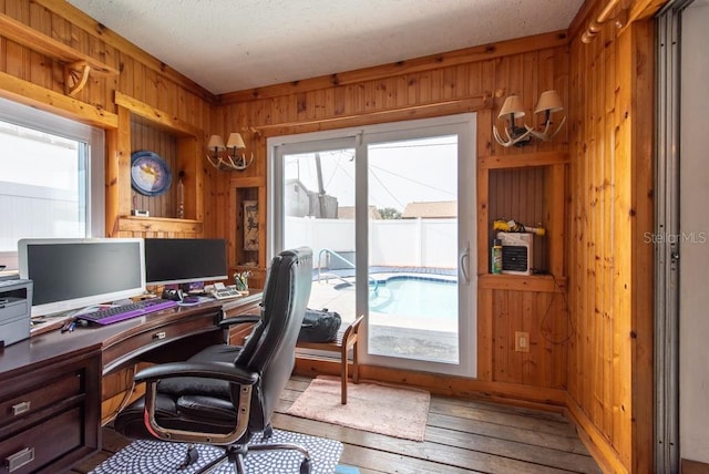 8305 75th Pl, Seminole, FL 33777 - office with wood walls, plenty of natural light, and hardwood / wood-style flooring