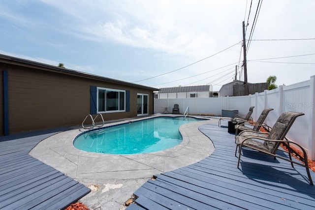 8305 75th Pl, Seminole, FL 33777 - view of pool featuring a fenced backyard and a wooden deck