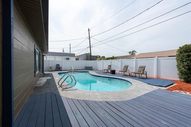8305 75th Pl, Seminole, FL 33777 - view of pool featuring a deck, a fenced backyard, and a patio