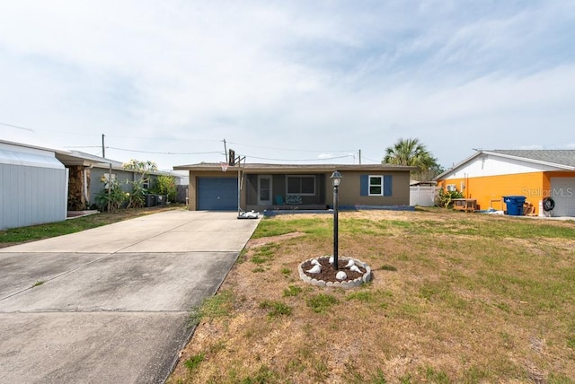 8305 75th Pl, Seminole, FL 33777 - ranch-style home featuring a garage, concrete driveway, and a front lawn