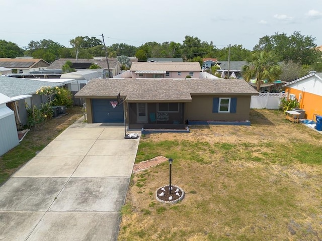 8305 75th Pl, Seminole, FL 33777 - single story home with an attached garage, roof with shingles, a sunroom, and driveway
