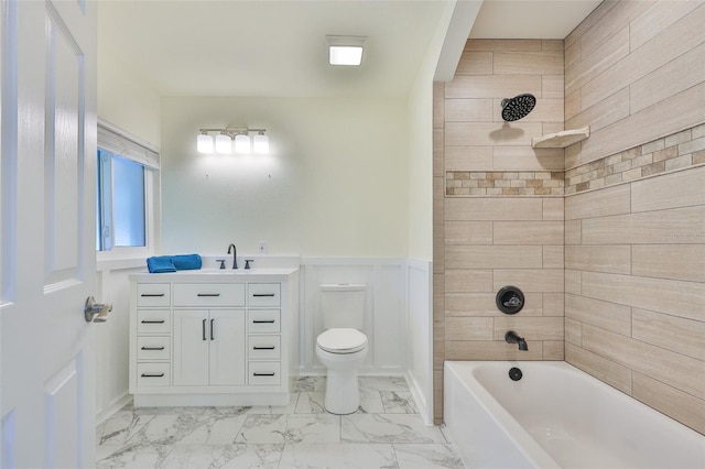 10922 Park Dr, Riverview, FL 33569 - full bath featuring marble look tile flooring, vanity, shower / washtub combination, and wainscoting