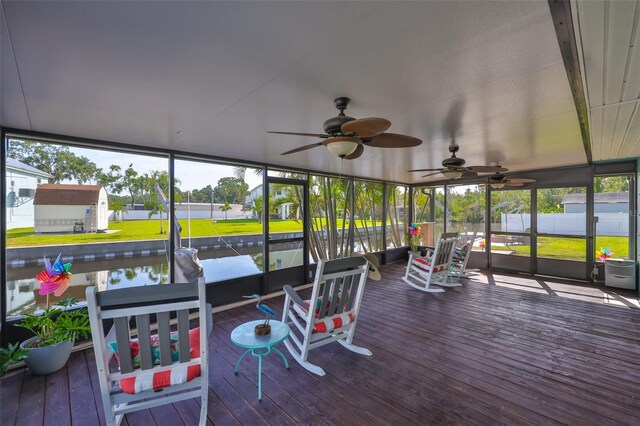 10922 Park Dr, Riverview, FL 33569 - sunroom / solarium featuring a ceiling fan and a water view