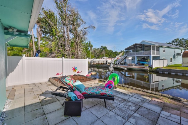 10922 Park Dr, Riverview, FL 33569 - view of patio with a water view and a dock