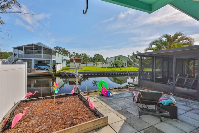 10922 Park Dr, Riverview, FL 33569 - view of patio with a sunroom and a water view