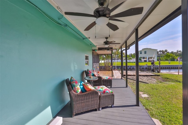 10922 Park Dr, Riverview, FL 33569 - deck featuring ceiling fan, a water view, and a lawn