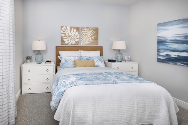 carpeted bedroom featuring baseboards