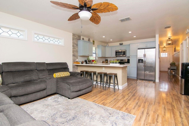 351 Hancock St, Dunedin, FL 34698 - living area with light wood-style floors, ceiling fan, and recessed lighting
