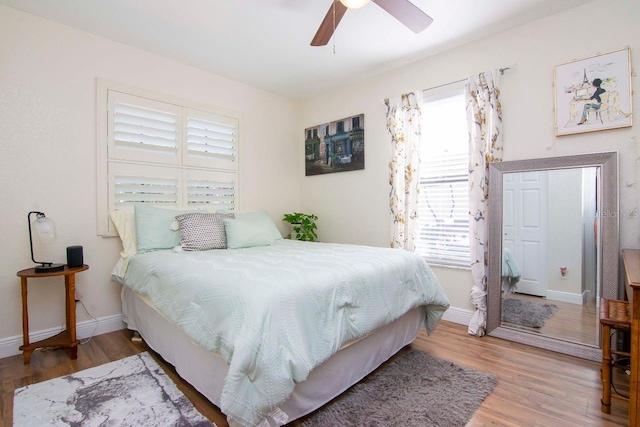 351 Hancock St, Dunedin, FL 34698 - bedroom featuring multiple windows, wood finished floors, and ceiling fan