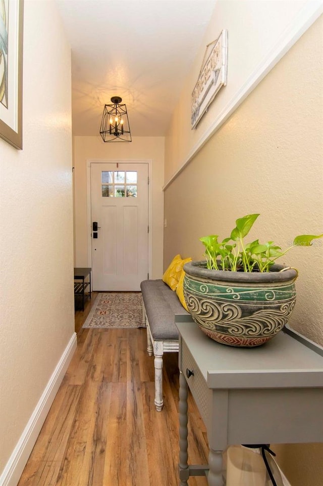 351 Hancock St, Dunedin, FL 34698 - foyer featuring light wood-style flooring and a chandelier