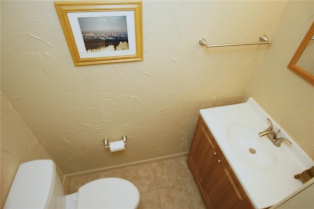 8011 Peach Dr Unit 103, Tampa, FL 33637 - bathroom with toilet, vanity, and tile patterned flooring