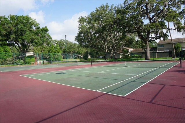 8011 Peach Dr Unit 103, Tampa, FL 33637 - view of tennis court with community basketball court and fence