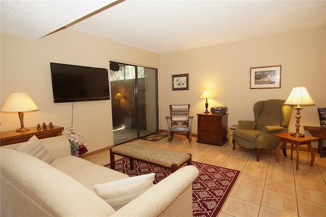 8011 Peach Dr Unit 103, Tampa, FL 33637 - living room featuring tile patterned floors and a textured ceiling
