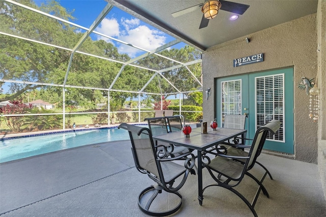 18631 Le Dauphine Pl, Lutz, FL 33558 - view of patio with ceiling fan, an outdoor pool, a lanai, and french doors