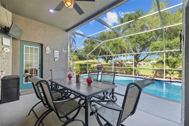 18631 Le Dauphine Pl, Lutz, FL 33558 - view of patio with a ceiling fan, an outdoor pool, and a lanai