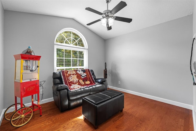 18631 Le Dauphine Pl, Lutz, FL 33558 - living area with wood finished floors, vaulted ceiling, ceiling fan, and baseboards