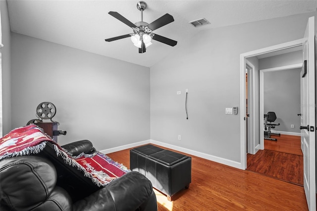 18631 Le Dauphine Pl, Lutz, FL 33558 - living area with a ceiling fan, vaulted ceiling, wood finished floors, and baseboards
