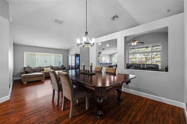 18631 Le Dauphine Pl, Lutz, FL 33558 - dining space with baseboards, lofted ceiling, wood finished floors, a chandelier, and a ceiling fan