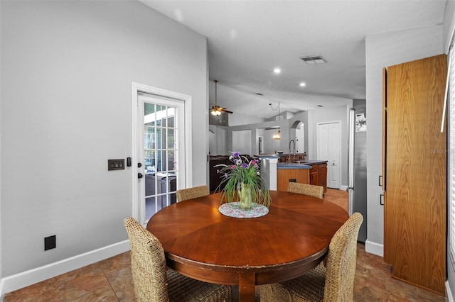 18631 Le Dauphine Pl, Lutz, FL 33558 - dining space featuring baseboards, ceiling fan, vaulted ceiling, stone finish floors, and recessed lighting