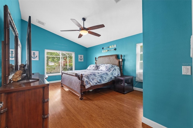 18631 Le Dauphine Pl, Lutz, FL 33558 - bedroom featuring lofted ceiling, wood finished floors, baseboards, and ceiling fan