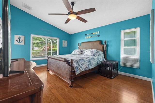 18631 Le Dauphine Pl, Lutz, FL 33558 - bedroom featuring lofted ceiling, wood finished floors, baseboards, and a ceiling fan