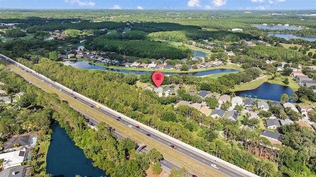 18631 Le Dauphine Pl, Lutz, FL 33558 - aerial overview of property's location with a nearby body of water, a main thoroughfare, and nearby suburban area