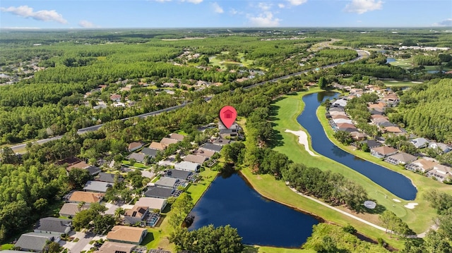 18631 Le Dauphine Pl, Lutz, FL 33558 - aerial view of property and surrounding area featuring nearby suburban area, a nearby body of water, a golf course, and a forest