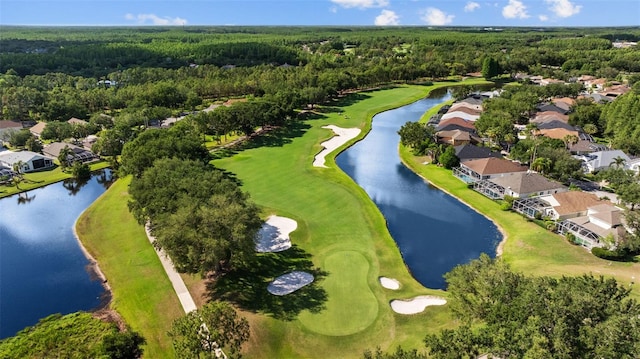 18631 Le Dauphine Pl, Lutz, FL 33558 - aerial perspective of suburban area featuring a heavily wooded area, a local golf course, and a large body of water