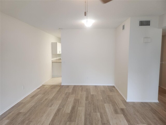 2293 Swedish Dr Unit 11, Clearwater, FL 33763 - unfurnished room with light wood-style flooring and baseboards