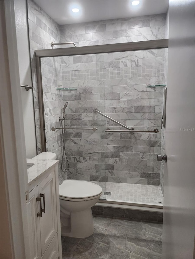 2293 Swedish Dr Unit 11, Clearwater, FL 33763 - bathroom featuring a shower stall, toilet, recessed lighting, and vanity