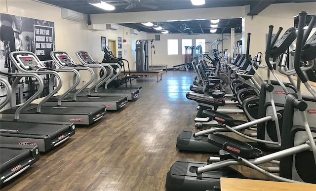 2293 Swedish Dr Unit 11, Clearwater, FL 33763 - gym featuring wood finished floors and a wall mounted air conditioner
