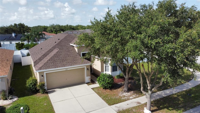 11021 Silver Dancer Dr, Riverview, FL 33579 - view of front of property featuring stucco siding, a shingled roof, a garage, and concrete driveway
