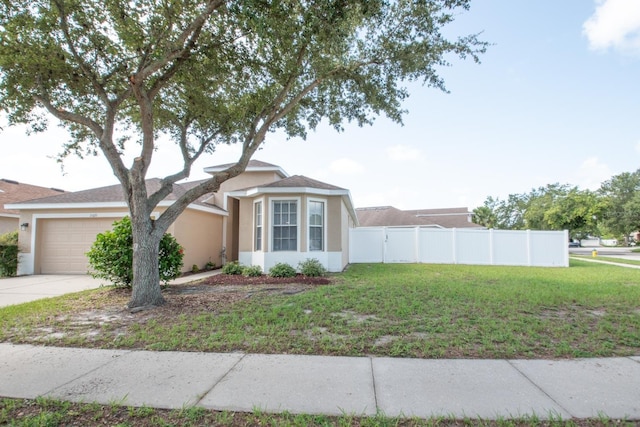 11021 Silver Dancer Dr, Riverview, FL 33579 - view of front of property featuring stucco siding, an attached garage, and concrete driveway