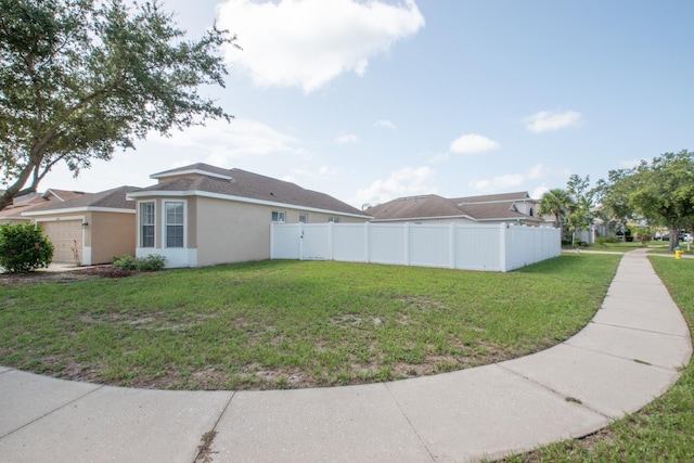 11021 Silver Dancer Dr, Riverview, FL 33579 - view of property exterior with stucco siding and a garage