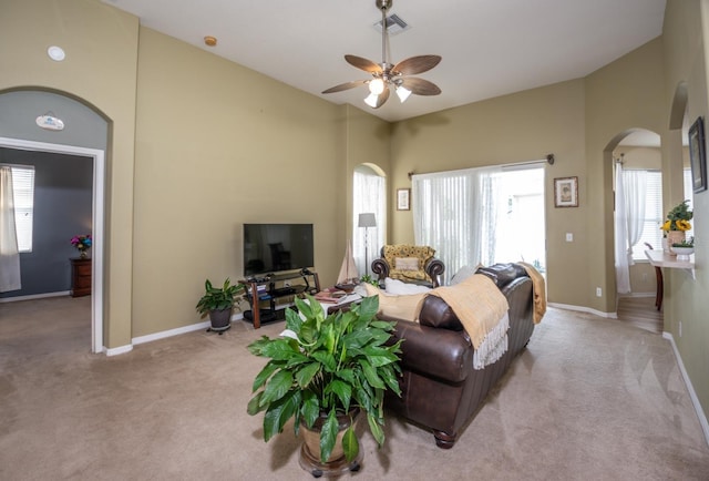 11021 Silver Dancer Dr, Riverview, FL 33579 - living room featuring arched walkways, carpet flooring, plenty of natural light, and vaulted ceiling