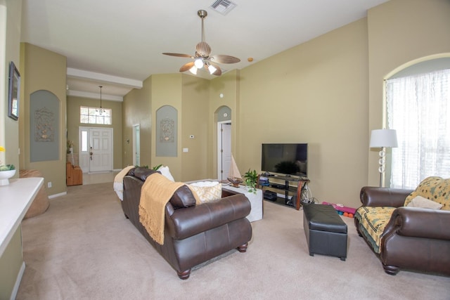 11021 Silver Dancer Dr, Riverview, FL 33579 - living room with lofted ceiling, light carpet, arched walkways, a ceiling fan, and baseboards