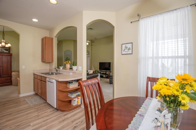 11021 Silver Dancer Dr, Riverview, FL 33579 - dining space with arched walkways, a ceiling fan, light wood-style floors, recessed lighting, and baseboards