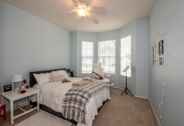 11021 Silver Dancer Dr, Riverview, FL 33579 - bedroom featuring light carpet, baseboards, and a ceiling fan