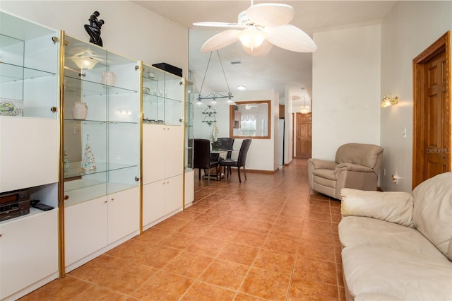 living area with ceiling fan